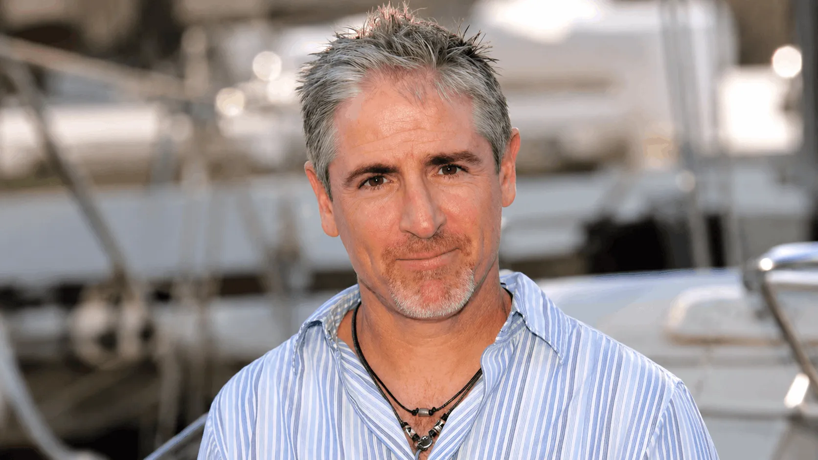 Carlos Alazraqui smiling at a comedy industry event