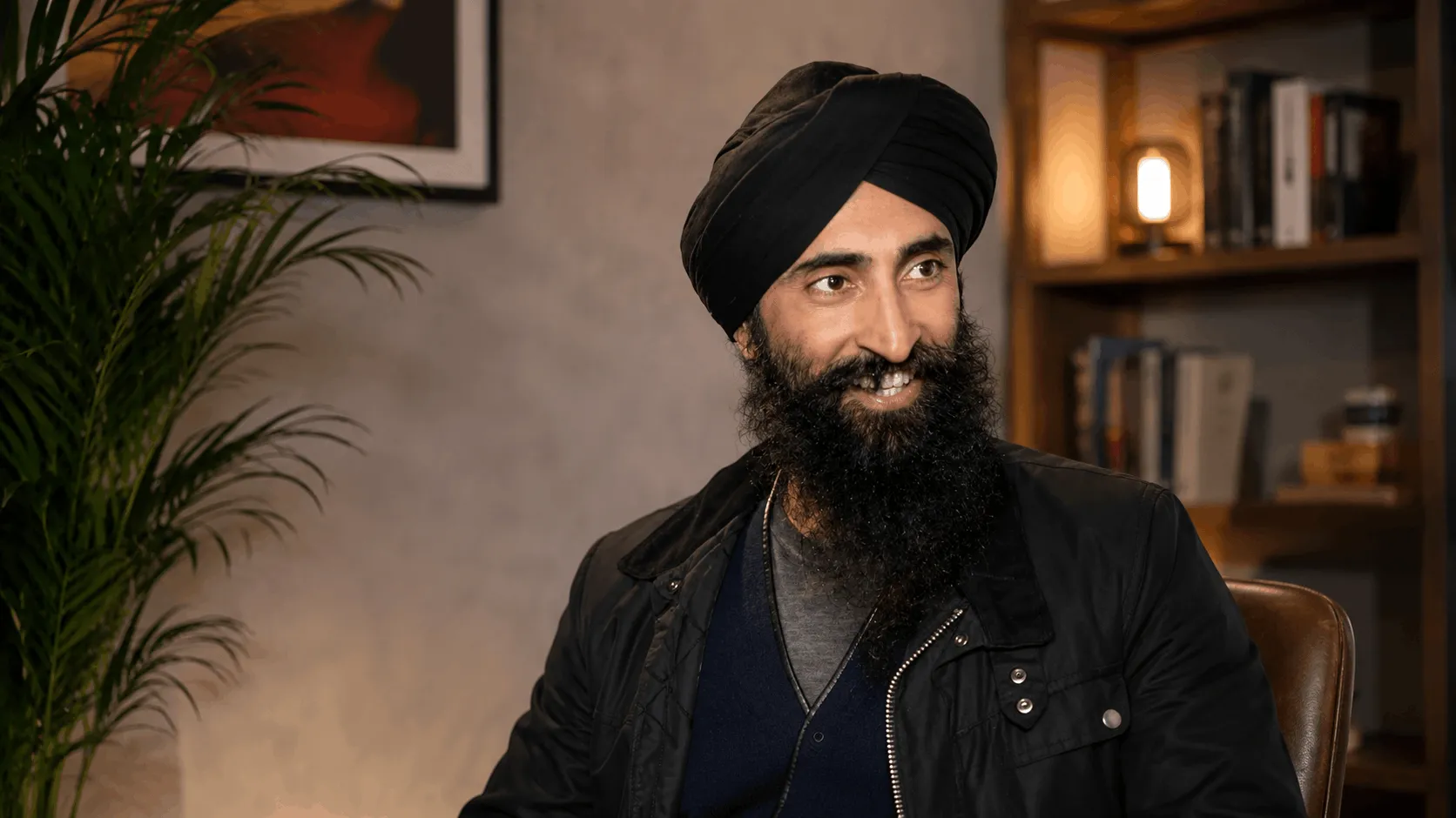 waris ahluwalia at a public event in a black turban and suit